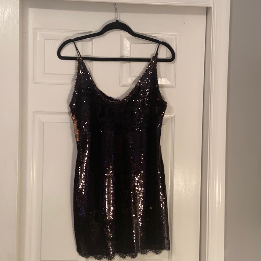 changing sequence black and copper dress